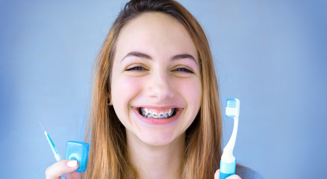 This is the image for the news article titled How to Brush Your Teeth With Braces